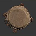 Traditional Brown Hand Drum as Household Item with Carved Patterns and Leather Head Design