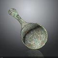 Ancient Bronze Spoon With Ornate Carved Patterns And Curved Handle Design