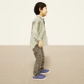Little Boy Smiling In Light Background Wearing Green Checkered Shirt Gray Pants Blue Shoes