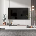 Modern White TV Stand With Flat Screen TV Decorative Items And Green Plant