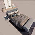 Modern Double Bed with Gray Headboard Pillows Striped Quilt Footstool Nightstand Lamp Wall Art