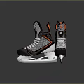 Black Gray Ice Hockey Skates With Orange Accents White Laces And Steel Blades