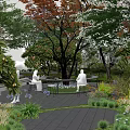 Park Landscape With Lush Trees Colorful Flowers And People Enjoying Sunlight
