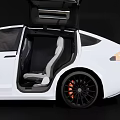 White Tesla Model X With Open Falcon Wing Doors On Dark Background