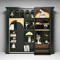 Stylish Dark Green Decorative Cabinet Featuring Multiple Compartments With Ballet Figurines Books And White Flowers