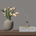 Beige Vase With Cream White Tulips And Reed Diffuser On Books Wooden Table