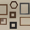 Various Shapes Brown Black Photo Frames Arranged On Beige Wall