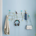 Modern Blue Wall Mounted Hook Organizer with Hanging Headphones Purse Towel and Colorful Beads