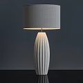 Modern White Ceramic Vertical Striped Table Lamp With Gray Fabric Lampshade Illuminated