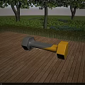 Gray and Yellow Dumbbell Shaped Outdoor Chair on Wooden Deck with Trees and Bushes