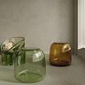 Modern Glass Stool With Green Yellow Vases On White Countertop By Window Blinds
