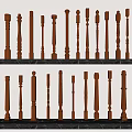 Collection Of Wooden Balusters With Different Decorative Designs On Marble Shelves