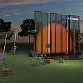 Outdoor Stage Setup With Orange Circular Structure Glass Curtain Wall And Lighting Equipment At Sunset
