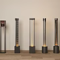 Different Design Floor Lamps with Grille and Cylindrical Black Base Illuminated on Wooden Floor