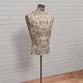 Three Classic Formal Suits On Mannequins With Brick Wall And Wooden Floor
