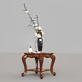 Wooden Side Table With Carved Legs Black Vase White Flowers And Small Decorative Ball