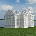 White Building With Glass Roof And Large Windows On Green Grass By Waterfront