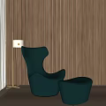 Teal Armchair With Ottoman Floor Lamp Light Colored Floor And Wooden Wall