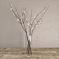 Clear Glass Vase With Pink Flower Branches On Wooden Table Against Gray Wall