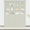 Light Green Display Cabinet Featuring Glass Door Upper Section And Decorative Items Inside