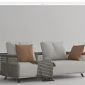 Rattan Frame Outdoor Sofa With White Cushions Brown Pillows And Striped Throw
