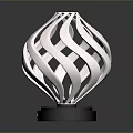 Stylish Modern Electronic Appliance Featuring Silver Spiral Design And Black Base