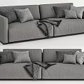 Modern Gray Two Seater Sofa With Plush Pillows And Checkered Blanket 3d model