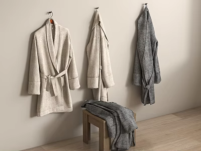 Beige And Gray Bathrobes Hanging On Light Wall With Wooden Stool Holding Blanket 3d model