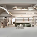 KIMMORE Modern Clothing Store Interior With Curved Design Displayed Clothes Sofa Mirror Plant And Shelves