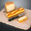 Fresh Baked Bread And Baguette On Wooden Cutting Board With Butter Slice And Knife