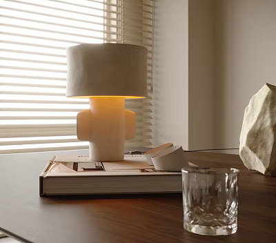 Modern Table Lamp with Beige Lampshade on Large Book Small Cup Glass and Wooden Table 3d model