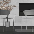 Modern Black And Transparent Leisure Chairs In Living Room With Fireplace Cabinet And Plant