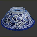 Blue and White Ceramic Sculpture Carving With Intricate Floral Patterns And Bowl Shape