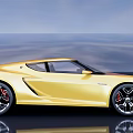 Yellow Sports Car With Sleek Exterior Design And Shiny Alloy Wheels On Blue Sky