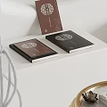Elegant Black Brown Hardcover Books With Decorative Patterns On White Table 3d model