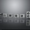 White Air Conditioner Units In Different Sizes With Grille Design On Reflective Surface