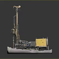 Industrial Yellow Drilling Machine With Tall Drill Tower And Gravel Covered Base