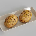 Whole Grain Buns Topped with Nuts and Oats on White Rectangular Plate