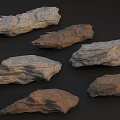 Various Colored Natural Stone Pieces With Detailed Textured Surfaces And Gray Brown Tones
