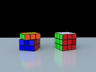 Two Colorful Rubik's Cubes With Different Colored Faces On Gray Surface 3d model