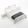 Elegant Double Bed With Curved Metal Headboard White Bedding Dark Blanket And Bedside Tables