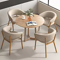 Modern Round Wooden Table And Beige Curved Backrest Chairs Set With Potted Plant And Magazines