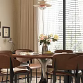 Round Dining Table Set With Four Chairs Fresh Flowers And Black White Rug