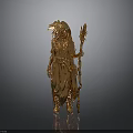 Golden Woman Statue In Ornate Clothing With Feather Headdress Holding Long Staff