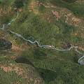 Aerial Planning View of Winding River Through Green Mountains Forest and Villages