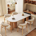 Cozy Modern Dining Room With Oval Table Light Chairs White Flower Vase And Decorations
