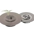 Round Modern Coffee Tables With Metal Base Smooth Surface Green Plant In Vase And Books