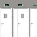 Three White Safety Doors With Small Windows And Green Exit Signs