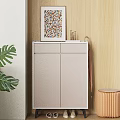 Modern Light Grey Shoe Cabinet With Colorful Photo Frame Umbrella And Green Plant