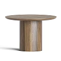 Modern Round Wooden Dining Table With Beige Upholstered Chairs And Black Metal Legs